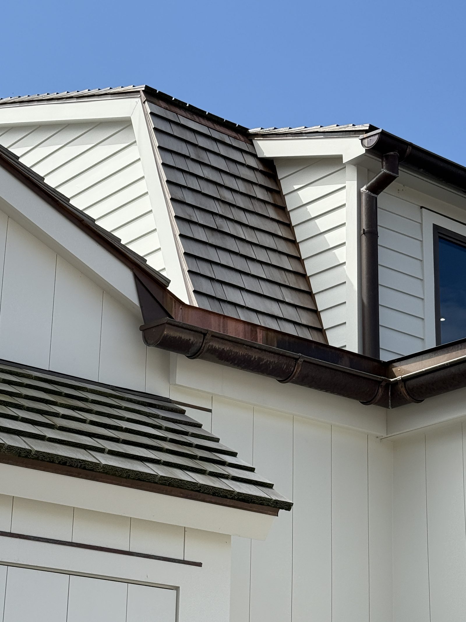 Cedar shake roof with copper gutter detail — Connecticut.