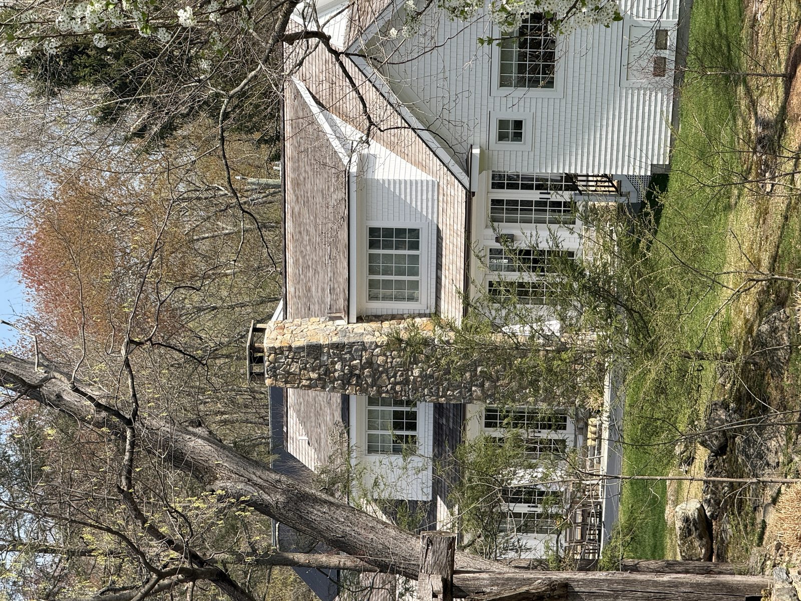 Fieldstone chimney with cedar shake roof — Connecticut.